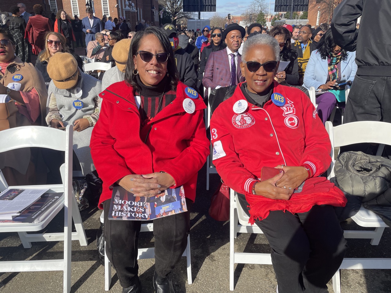 Delta Sigma Theta members Elora Cyrus of Silver Spring and Debroah Wilder of Largo arrive clad in their sorority colors to support new Maryland governor Wes Moore.