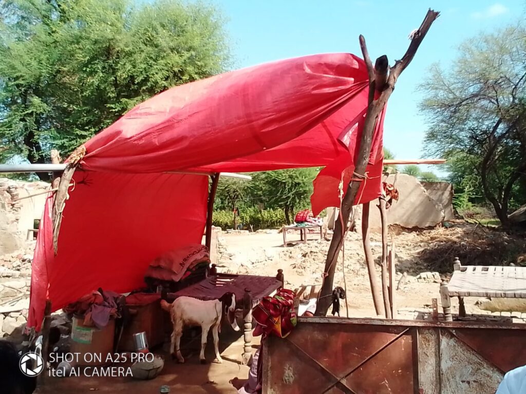 A red tent surrounded by rubble in Umerkot, Pakistan.