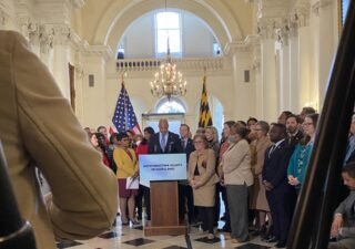 Gov. Wes Moore, surrounded by Lt. Gov. Aruna Miller, Speaker of the House Adrienne Jones, Senate President Bill Ferguson and Democratic members of the House and Senate, announces his support of a bill that would ask voters to cement the right to an abortion in Maryland’s Constitution. (Photo by Kara Thompson/Capital News Service)