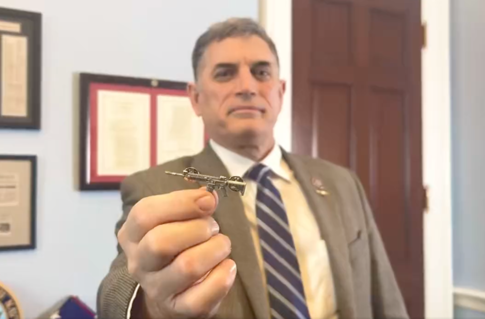 Rep. Andrew Clyde, D-Georgia, holds an AR-15 lapel that he passed out to some House members. Twitter/@Rep_Clyde
