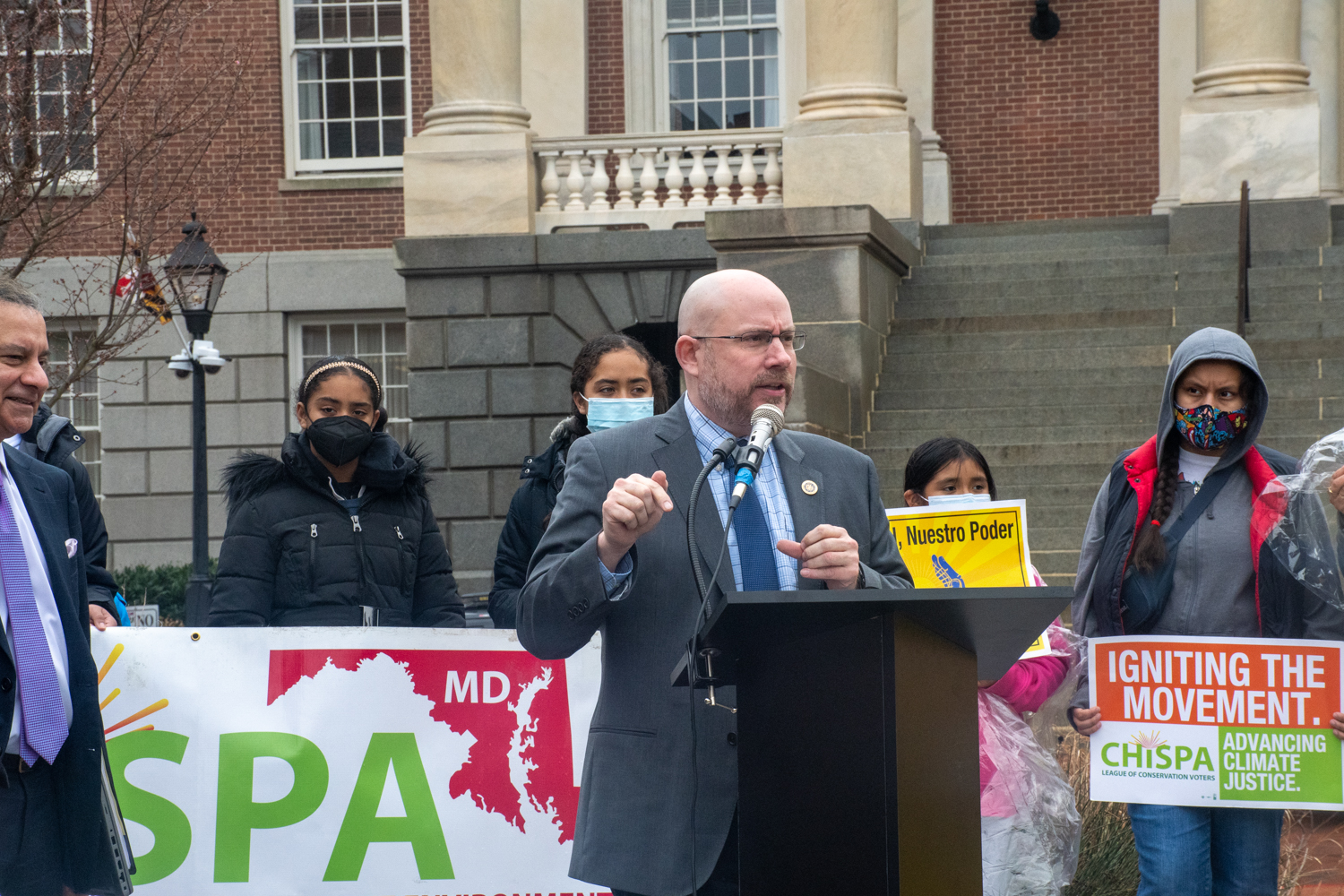 Latino Caucus Chair Del. David Fraser-Hidalgo advocates for electric buses at a rally in front of the State House on Feb. 22, 2022. (Christine Zhu/Capital News Service)
