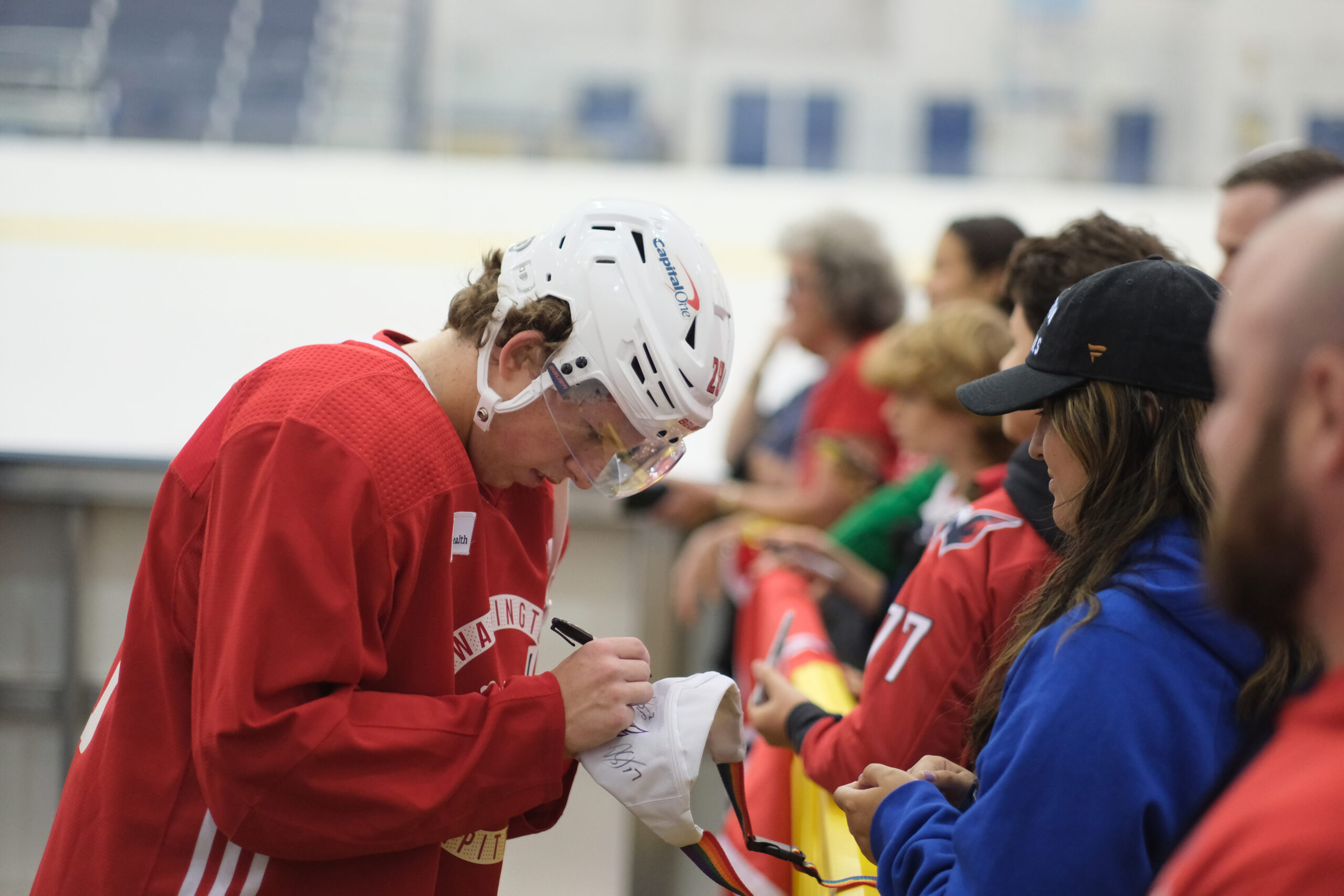 Capitals 2023 second-round pick Andrew Cristall signs autographs for fans after rookie camp Sunday Sept. 17, 2023. (CNS/Tommy Tucker)