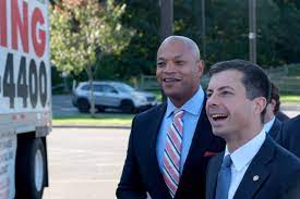 Gov. Wes Moore and U.S. Transportation Secretary Pete Buttigieg observe a commercial tractor trailer demonstration at Prince George's Community College Wednesday, Oct. 11, 2023. (Capital News Service/Tommy Tucker)