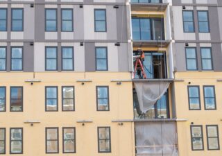 A construction worker works on a new highrise apartment in College Park, Maryland. (Photo by Nira Dayanim/Capital News Service)