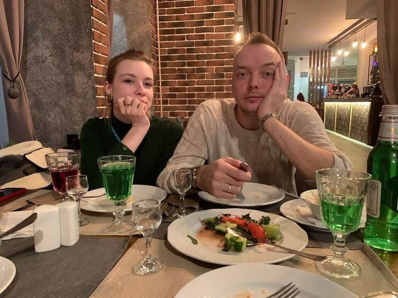 Ivan Safronov sitting next to his fiancé Ksenia Mironova.