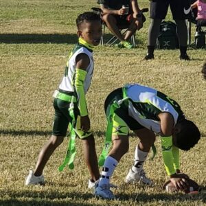 Malik Oliver, 9, plays quarterback in a flag football game. Muhammad Oliver, a former NFL defensive back for the Denver Broncos, Green Bay Packers, Kansas City Chiefs, Miami Dolphins and Washington Football Team, said in an interview that he would not allow his son to play tackle football until age 12. (Photo courtesy of Oliver Family)