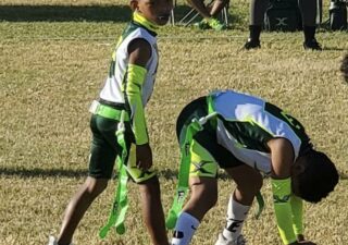 Malik Oliver, 9, plays quarterback in a flag football game. Muhammad Oliver, a former NFL defensive back for the Denver Broncos, Green Bay Packers, Kansas City Chiefs, Miami Dolphins and Washington Football Team, said in an interview that he would not allow his son to play tackle football until age 12. (Photo courtesy of Oliver Family)