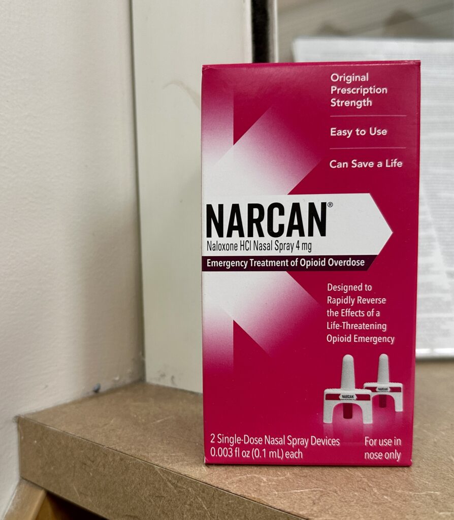 A box of Narcan nasal spray, the opioid-reversing medication that has been approved for over-the-counter use, sits on a pharmacy counter on Feb. 22, 2024. (Sapna Bansil/Capital News Service)