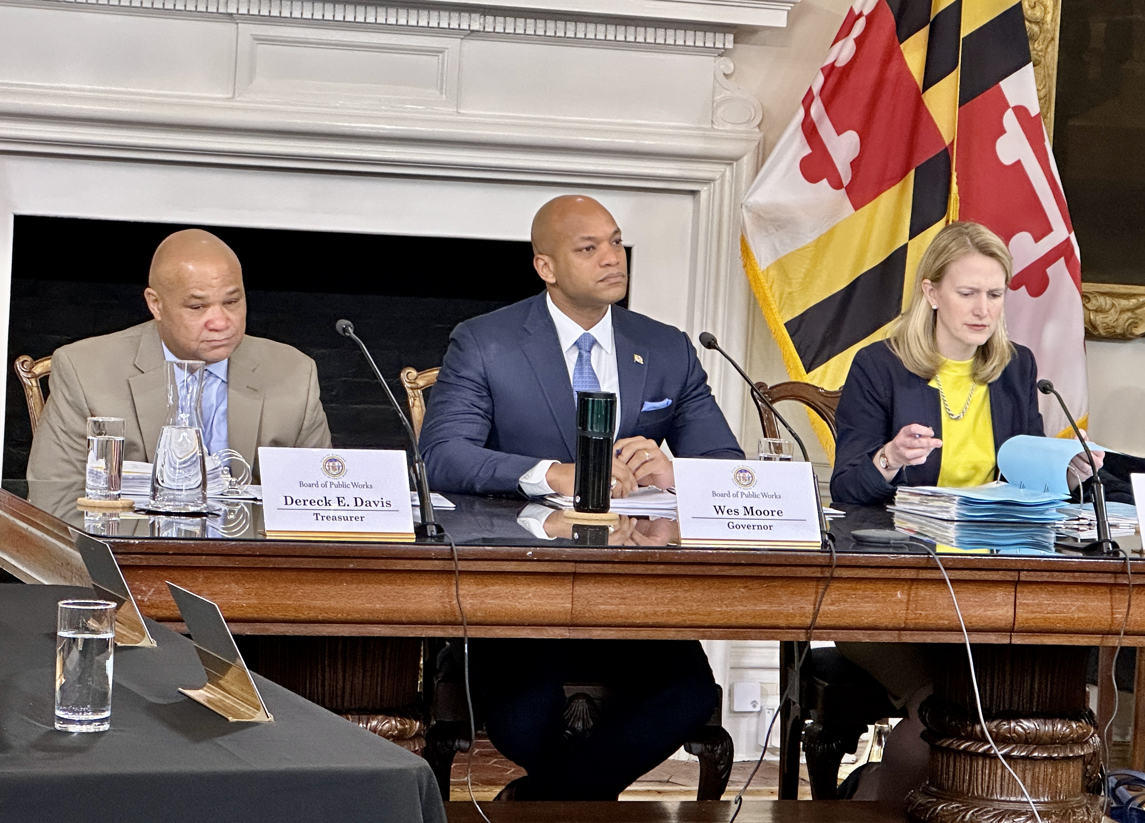 From left, State Treasurer Dereck Davis, Gov. Wes Moore and Comptroller Brooke Lierman listen to a presentation at a meeting of the Board of Public Works on March 13, 2024. (Sapna Bansil/Capital News Service)