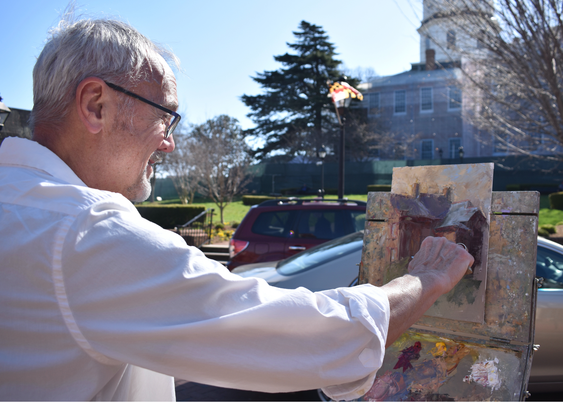 David Diaz painting in Annapolis. (Tyrah Burris/Capital News Service)