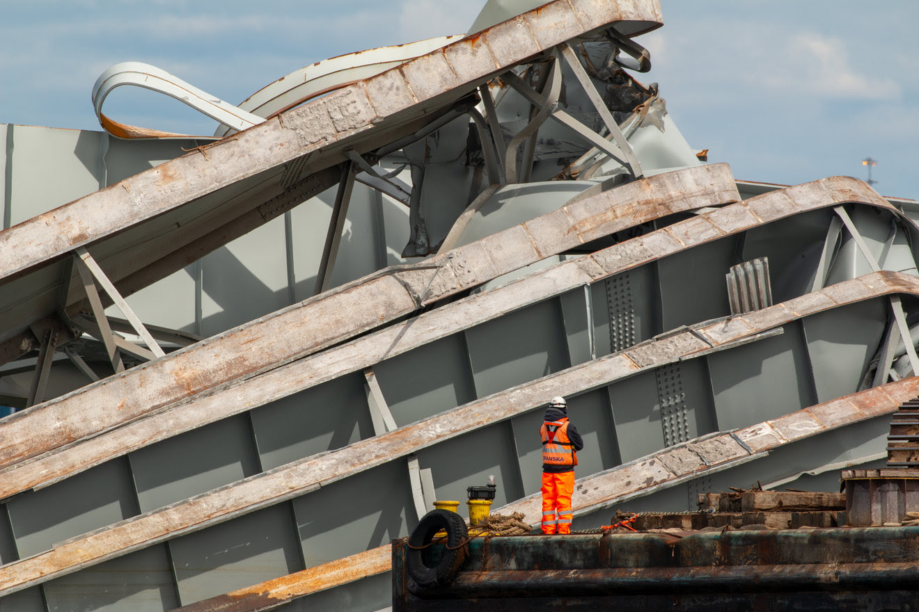 A salvage worker views wreckage of the Francisc Scott Key Bridge
