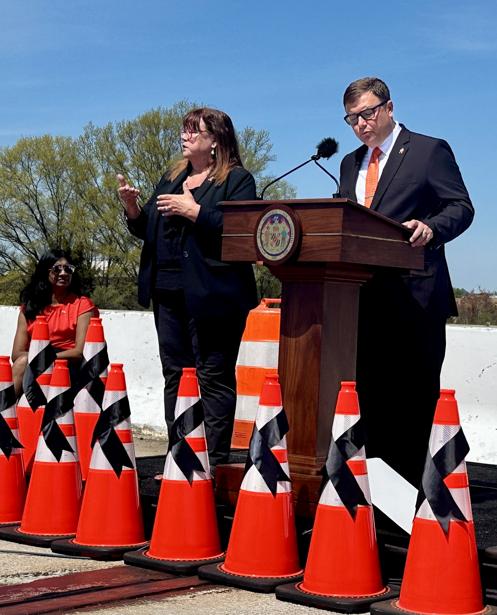 State Highway Administrator William Pines (right) speaks on April 16, 2024, at an event in Woodlawn marking National Work Zone Awareness Week. The event was held on an overpass near the site of a 2023 crash that killed six road workers. (Sapna Bansil/Capital News Service)