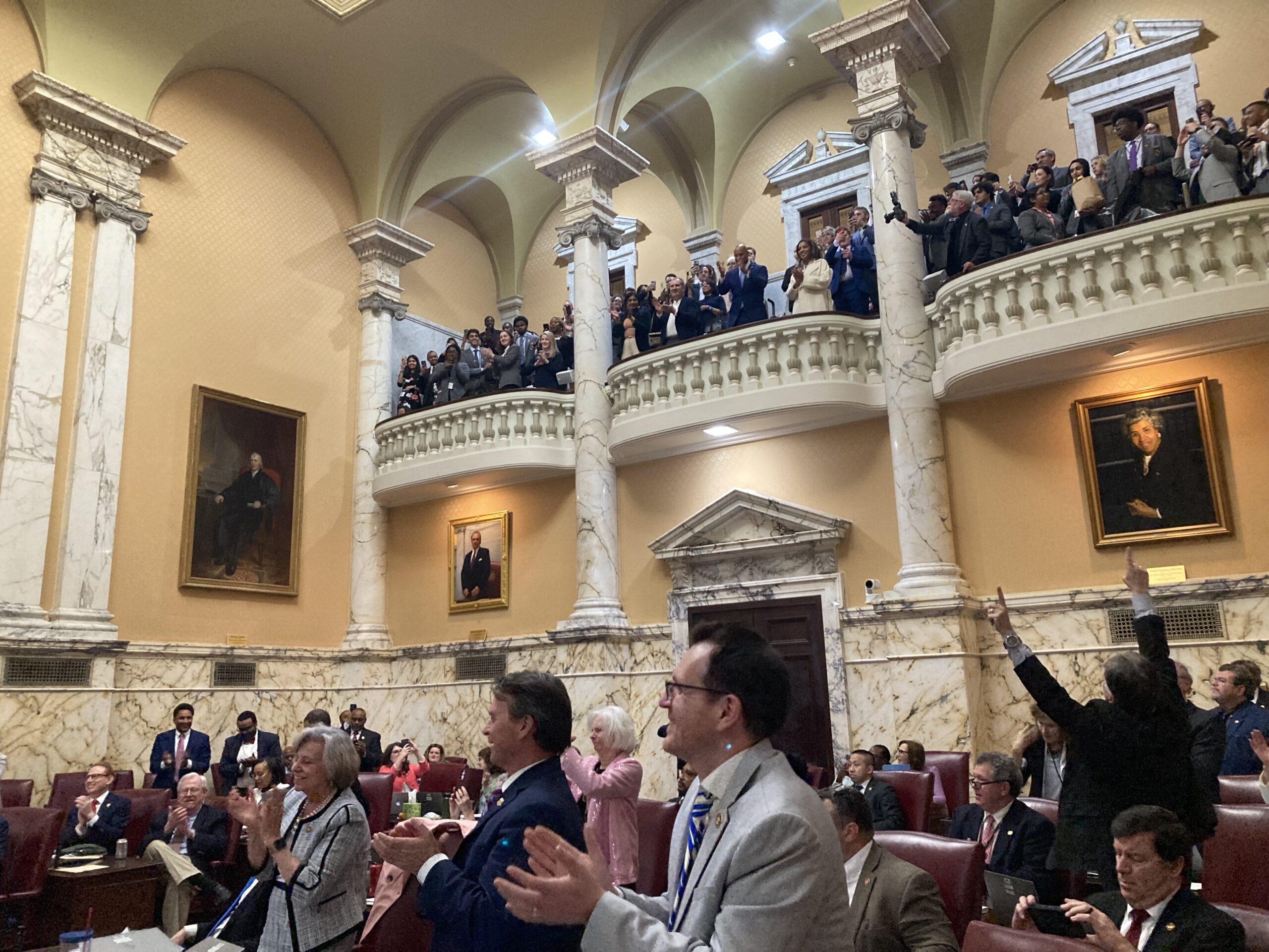 Senators applaud the passage of the PORT Act with Gov. Wes Moore looking on from the balcony in the final minutes of the 2024 legislative session.