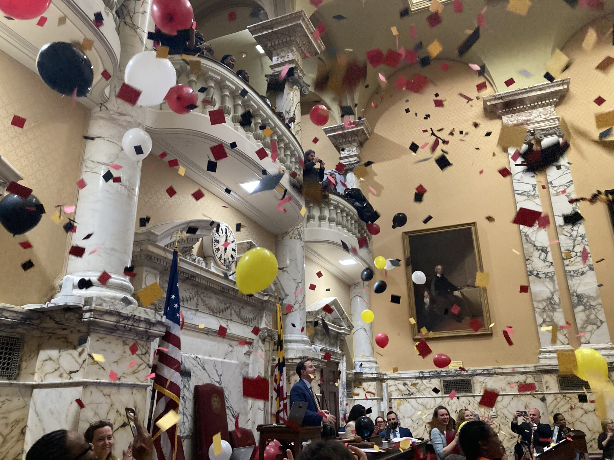 Senate President Bill Ferguson, D-Baltimore City, surveys the chamber floor through confetti and balloons at the end of the Maryland General Assembly Session on Apr. 8, 2024.