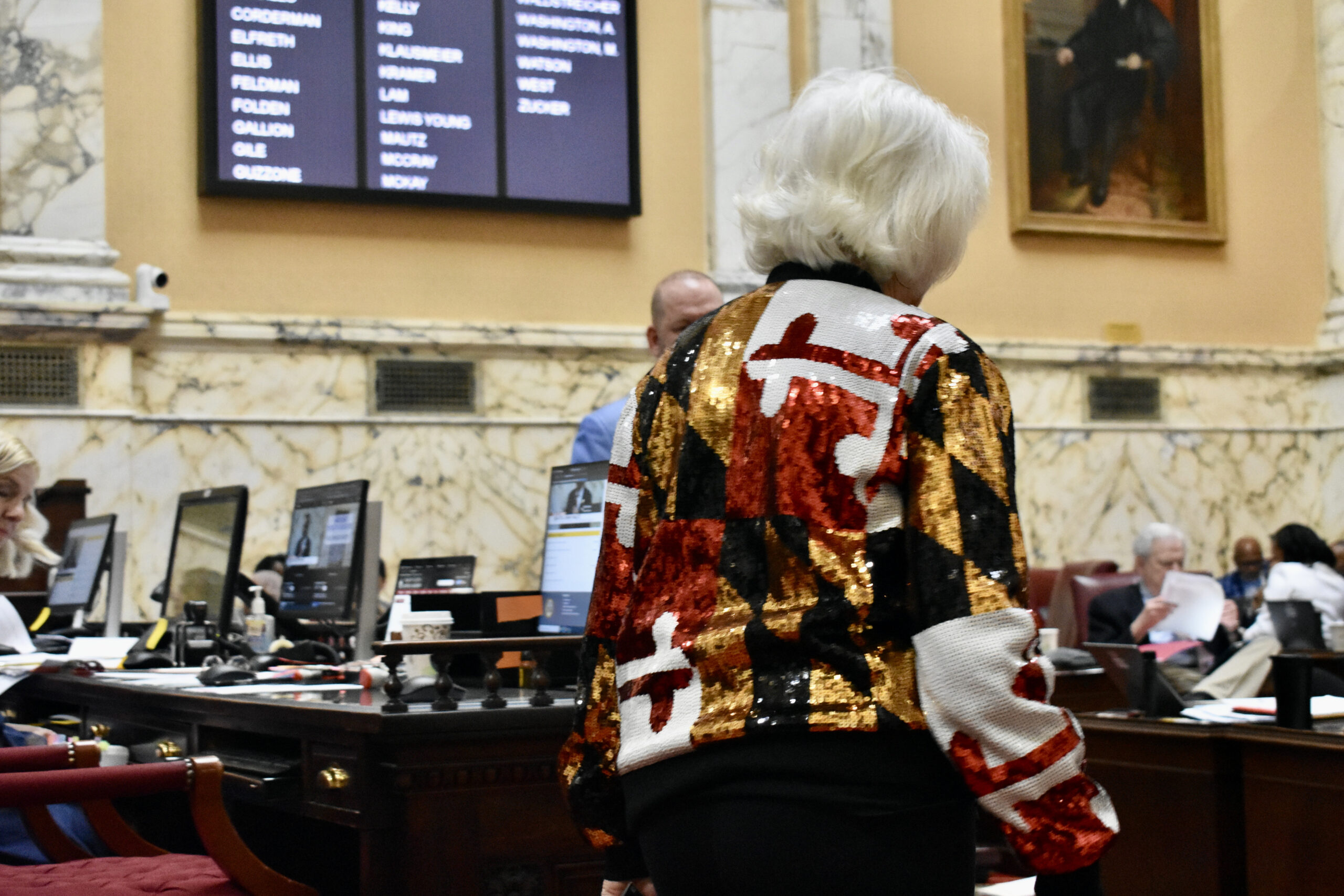 Sen. Kathy Klausmeier, D-Baltimore, wears a Maryland flag jacket on the Senate floor on sine die 2024.