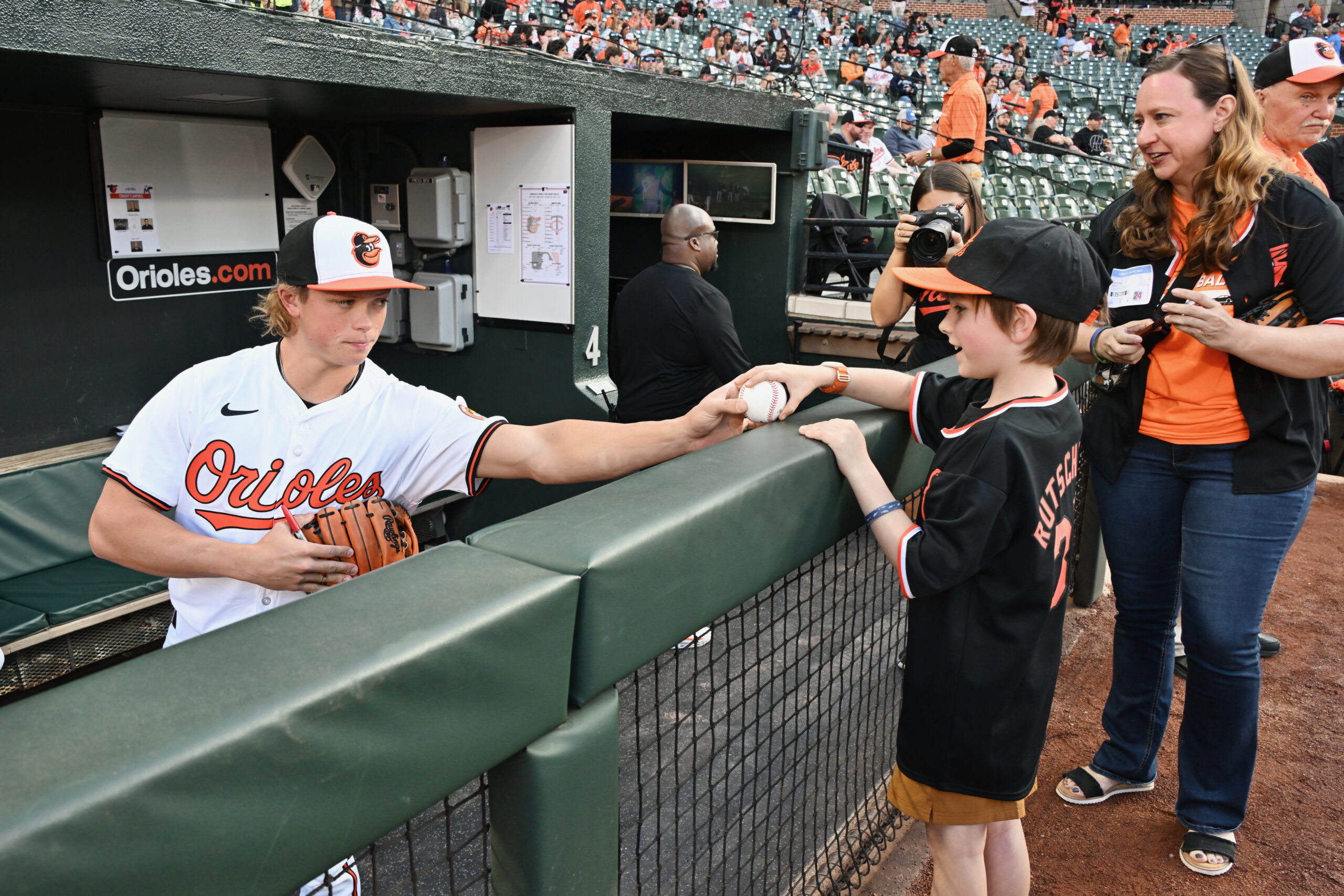 Jackson Holliday signs an autograph for a fan on April 16. The 20-year-old infielder hit just 2-for-34 over his first 10 games with the Orioles before being sent back down to the minor leagues on April 26.