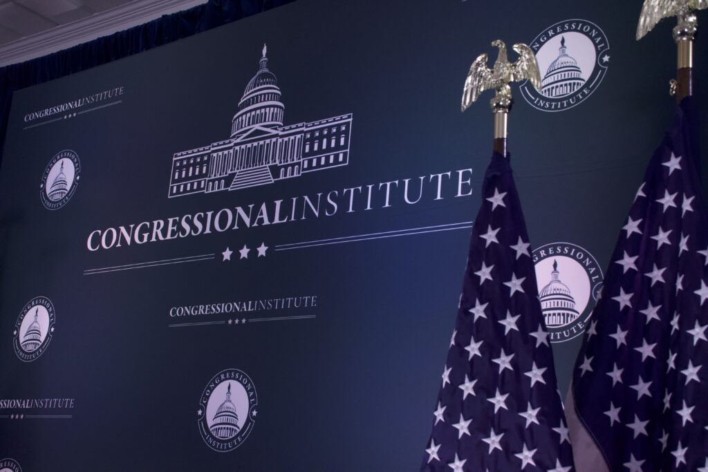 A photo of The Congressional Institute logo and the American flag.