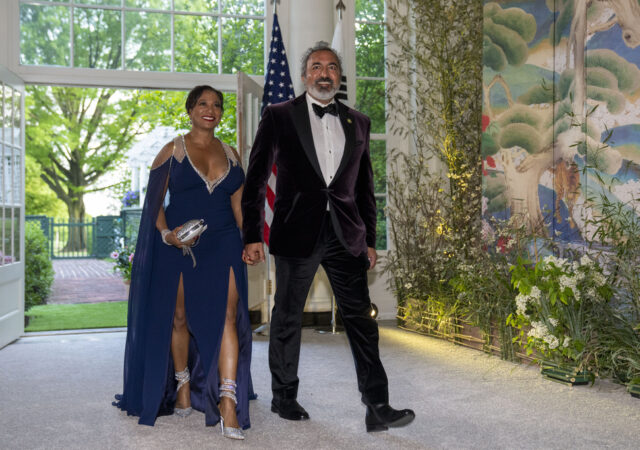 Dr. Janine Bera and Rep. Ami Bera, D-Calif., walk into a State Dinner for South Korea's President Yoon Suk Yeol at the White House Wednesday, April 26, 2023, in Washington. An array of private organizations has underwritten nearly $136,000 for Rep. Bera to bring his wife or child to Copenhagen, Tokyo, Switzerland, Iceland and an opulent resort in Sea Island, Georgia, among other places, trip records show. (AP Photo/Alex Brandon)