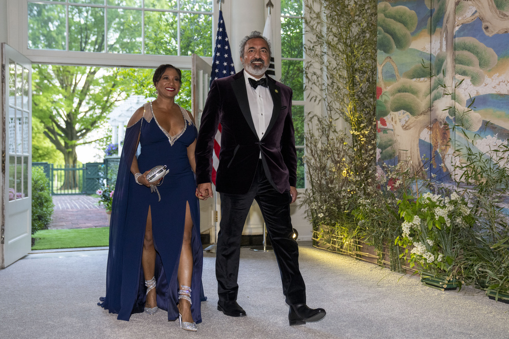 Dr. Janine Bera and Rep. Ami Bera, D-Calif., walk into a State Dinner for South Korea's President Yoon Suk Yeol at the White House Wednesday, April 26, 2023, in Washington. An array of private organizations has underwritten nearly $136,000 for Rep. Bera to bring his wife or child to Copenhagen, Tokyo, Switzerland, Iceland and an opulent resort in Sea Island, Georgia, among other places, trip records show. (AP Photo/Alex Brandon)