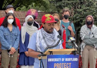 University of Maryland's Students for Justice in Palestine board member Abel Amene speaks from a podium at a press conference on Sept. 17, 2024 announcing the filing of a federal lawsuit against the University of Maryland.