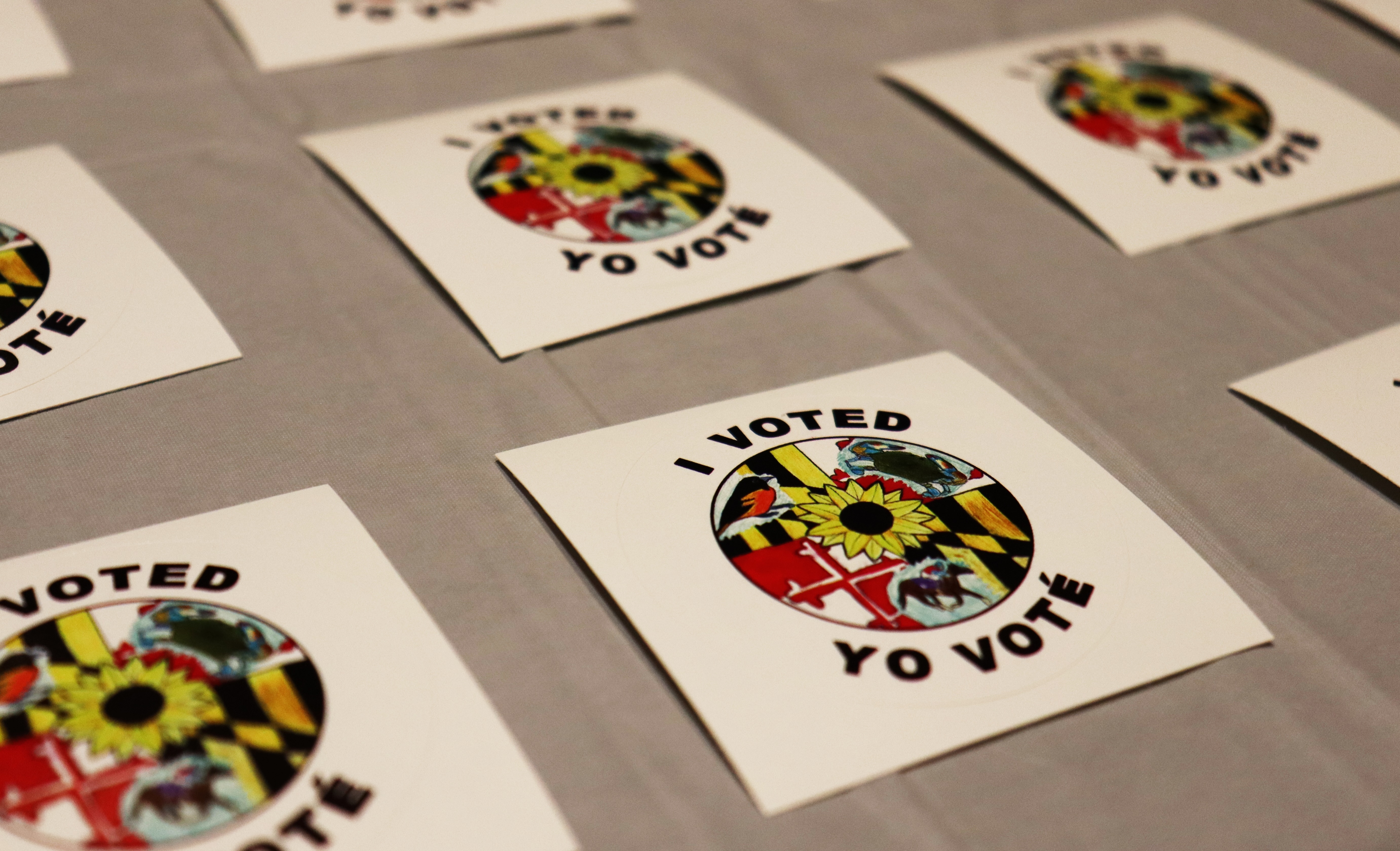 "I Voted" stickers with Spanish translation "Yo Voté" set out on the first day of early voting (October 24, 2024) at the Silver Spring Civic Building in Silver Spring, Maryland. (Caley Fox Shannon/Capital News Service)