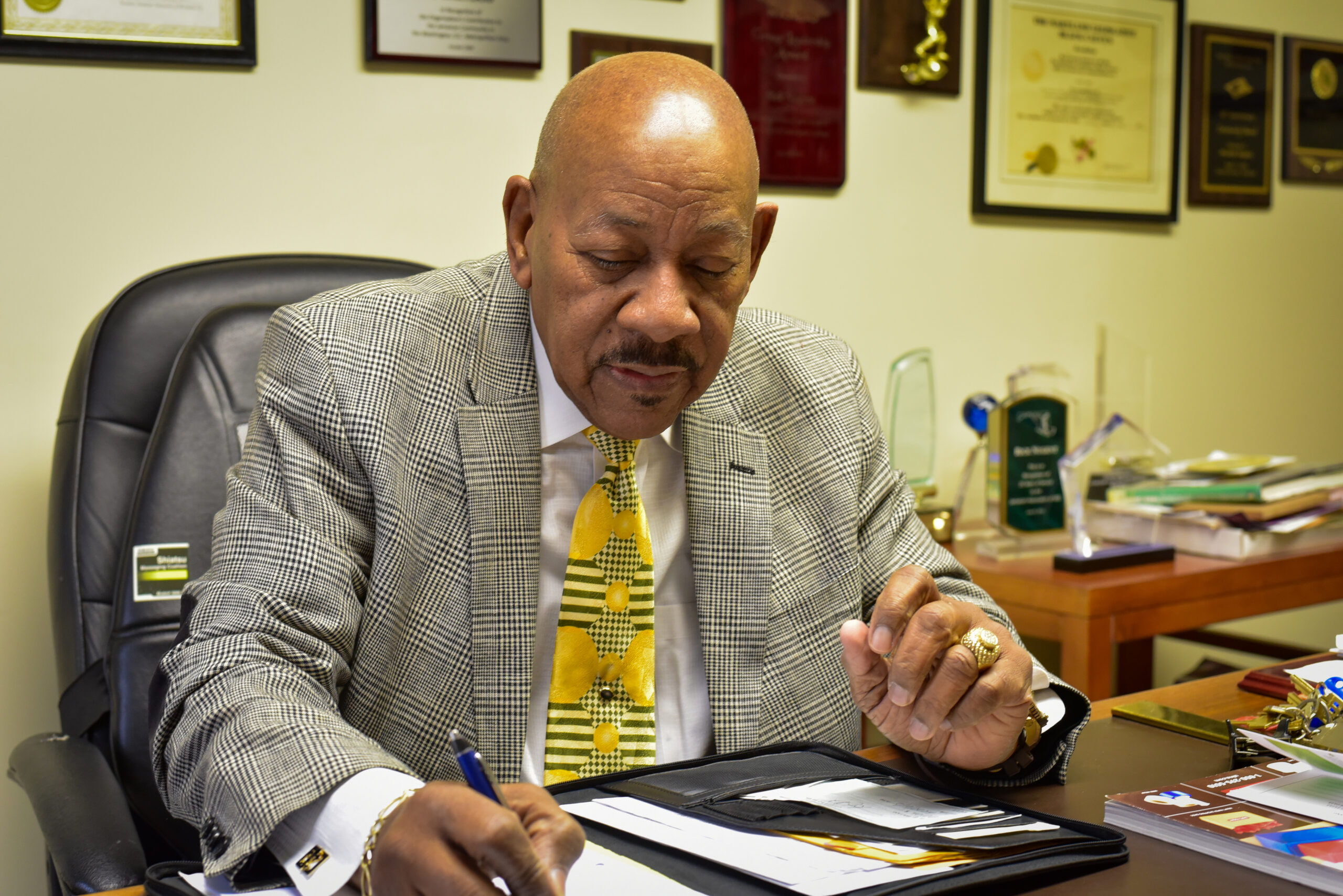 Man in his office at a desk.