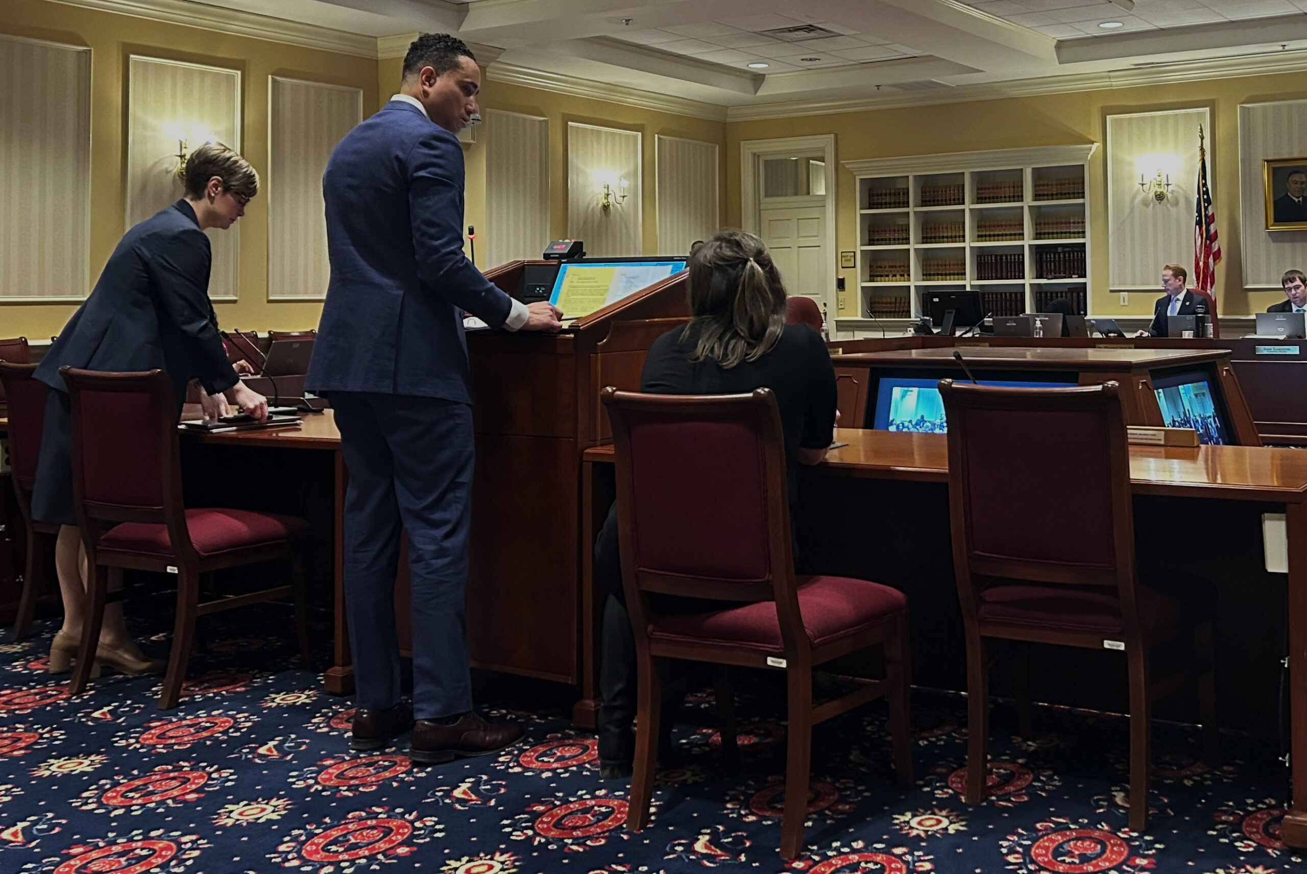 Sen. William Smith, a Democrat representing Montgomery County, stands at the dais ahead of a Senate Judicial Proceedings Committee hearing on his automatic sentencing reform bill.