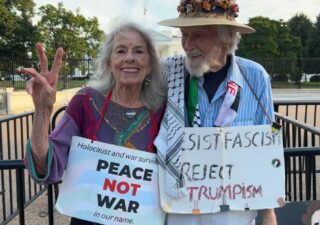 Peace activists stand outside the White House in the fall of 2025.