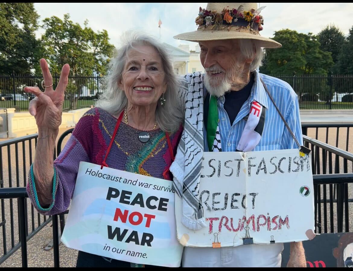 Peace activists stand outside the White House in the fall of 2025.