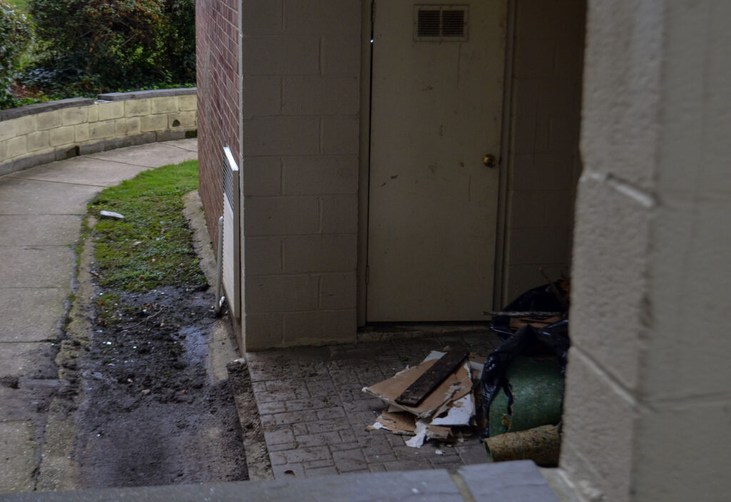 Construction materials outside a patio at Heather Hill Apartments.