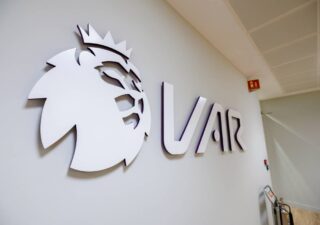 VAR logo on wall of